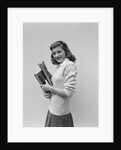 Smiling brunette teen student wearing sweater carrying school books by Anonymous