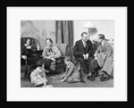 Family mother father two kids playing on floor visiting with another couple by Anonymous