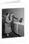 Young couple man woman shopping for washing machine by Anonymous