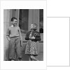 Smiling boy & girl holding school books by doors by Anonymous
