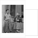 Smiling boy & girl holding school books by doors by Anonymous
