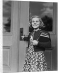 Smiling girl print dress holding school books opening door by Anonymous