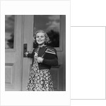 Smiling girl print dress holding school books opening door by Anonymous
