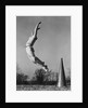Male cheerleader jumping cheering megaphone on ground by Anonymous