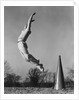 Male cheerleader jumping cheering megaphone on ground by Anonymous