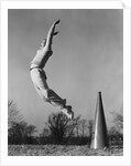 Male cheerleader jumping cheering megaphone on ground by Anonymous