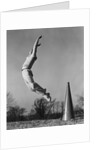 Male cheerleader jumping cheering megaphone on ground by Anonymous