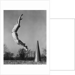 Male cheerleader jumping cheering megaphone on ground by Anonymous