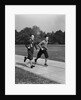 Two smiling boys running carrying school books by Anonymous