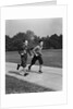 Two smiling boys running carrying school books by Anonymous