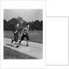 Two smiling boys running carrying school books by Anonymous