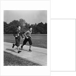 Two smiling boys running carrying school books by Anonymous