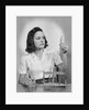 Young woman chemist holding up test tube by Anonymous