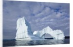 Arched iceberg in Disko Bay in Greenland by Anonymous