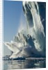 Calving iceberg in Disko Bay in Greenland by Anonymous