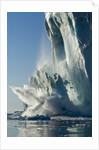 Calving iceberg in Disko Bay in Greenland by Anonymous