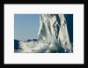 Calving iceberg in Disko Bay in Greenland by Anonymous