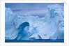 Hole melted in iceberg in Disko Bay in Greenland by Anonymous
