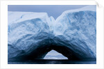 Arched iceberg in Disko Bay in Greenland by Anonymous