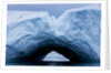 Arched iceberg in Disko Bay in Greenland by Anonymous