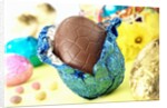 Chocolate Easter egg with opened foil by Anonymous