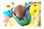 Chocolate Easter egg with opened foil by Anonymous