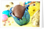 Chocolate Easter egg with opened foil by Anonymous