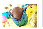 Chocolate Easter egg with opened foil by Anonymous