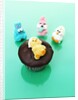 Muffin with chocolate icing and jelly chick for Easter by Anonymous