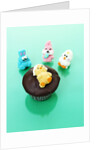 Muffin with chocolate icing and jelly chick for Easter by Anonymous