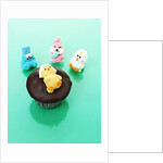 Muffin with chocolate icing and jelly chick for Easter by Anonymous