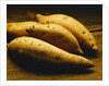 Yams on Wooden Table by Anonymous