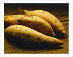 Yams on Wooden Table by Anonymous