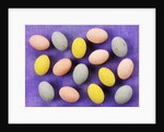 Small coloured Easter eggs on purple background by Anonymous