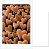Chocolate hearts, black background by Anonymous