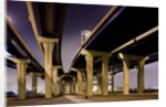 Highway overpasses at night by Anonymous