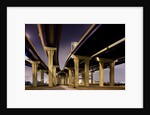 Highway overpasses at night by Anonymous
