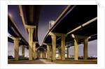 Highway overpasses at night by Anonymous