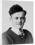 Young man smiles in a formal portrait, ca. 1920 by Anonymous