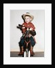 Little boy cowboy plays guitar while riding his horse, ca. 1956 by Anonymous