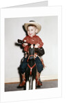 Little boy cowboy plays guitar while riding his horse, ca. 1956 by Anonymous
