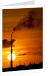 Flames and smoke billow from natural gas flare at Valero Oil Refinery at sunset by Anonymous