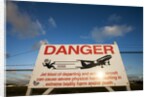 Warning sign near St. Maarten Airport, Netherlands Antilles by Anonymous
