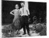 Young couple stands in front of their garage, ca. 1925 by Anonymous