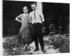 Young couple stands in front of their garage, ca. 1925 by Anonymous