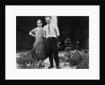 Young couple stands in front of their garage, ca. 1925 by Anonymous
