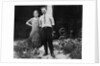 Young couple stands in front of their garage, ca. 1925 by Anonymous