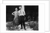 Young couple stands in front of their garage, ca. 1925 by Anonymous