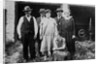 Family standing in front of garage, ca. 1925 by Anonymous