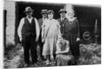 Family standing in front of garage, ca. 1925 by Anonymous
